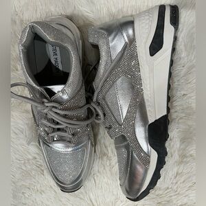 Steve Madden Silver Sneakers, with a small
Wedge heel.